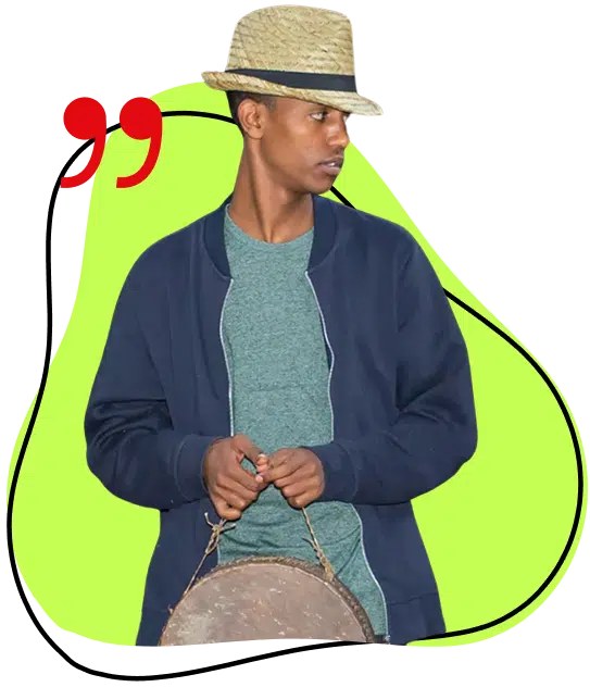 A young man wearing a straw hat, blue jacket, and green shirt holds a drum. A bright green abstract shape and red quotation mark decorate the background.