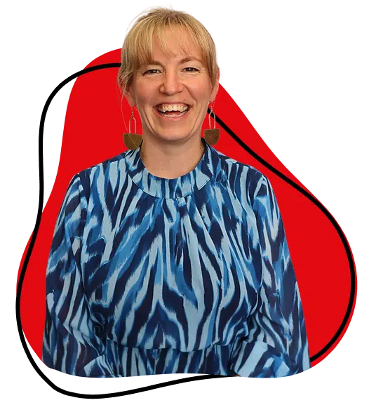 A smiling woman with blonde hair, wearing a blue and white patterned dress and large earrings, stands in front of a red and white abstract background.