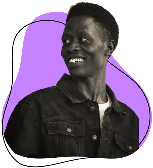 A person wearing a dark denim jacket smiles and looks to the side. The background features a purple abstract shape outlined with a black wavy line.